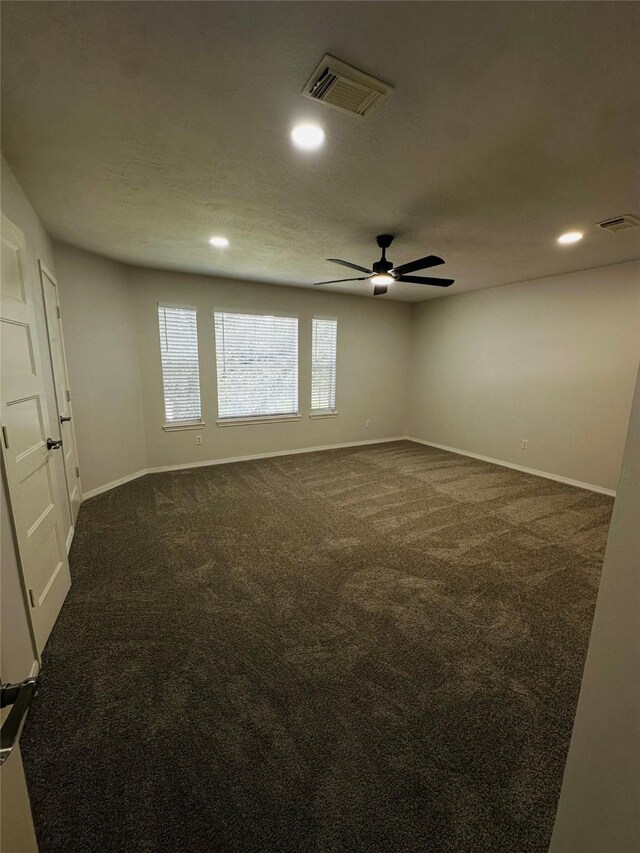 carpeted empty room with ceiling fan