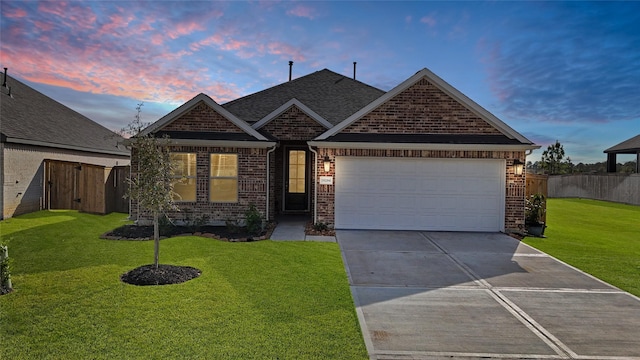 craftsman-style house with a yard and a garage