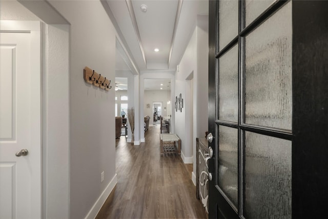 hallway with dark hardwood / wood-style floors