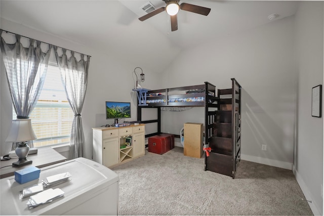 carpeted bedroom with vaulted ceiling and ceiling fan