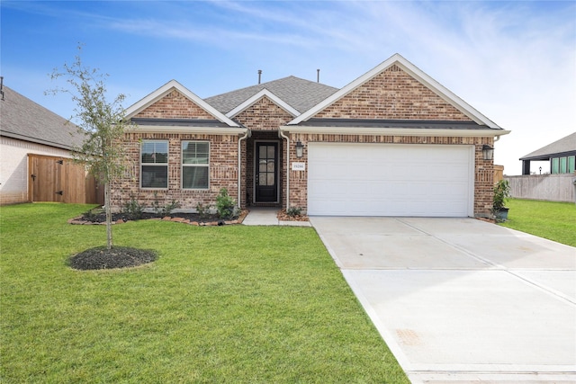 craftsman-style house featuring a front yard and a garage