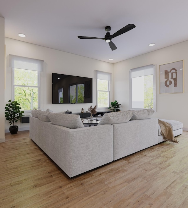 living area featuring recessed lighting, a ceiling fan, and light wood finished floors