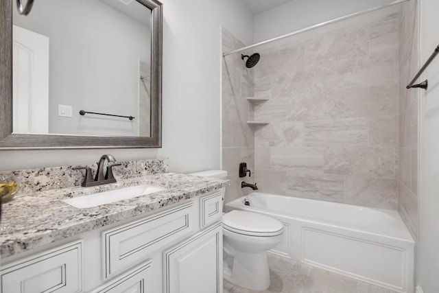 full bathroom with tiled shower / bath, vanity, and toilet