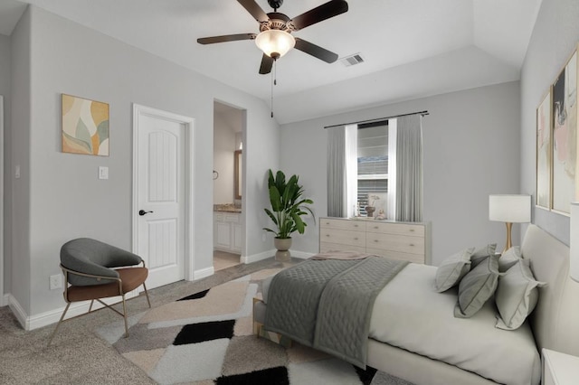 carpeted bedroom with lofted ceiling, ceiling fan, and ensuite bathroom