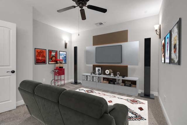 living room with light colored carpet and ceiling fan