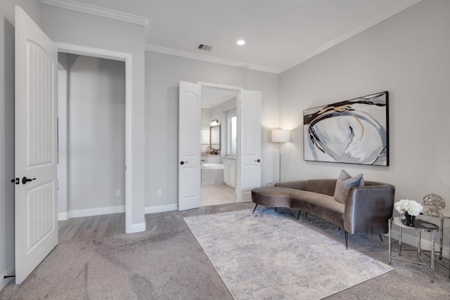 living area featuring ornamental molding and light carpet