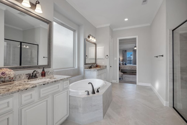 bathroom with independent shower and bath, crown molding, a wealth of natural light, and vanity