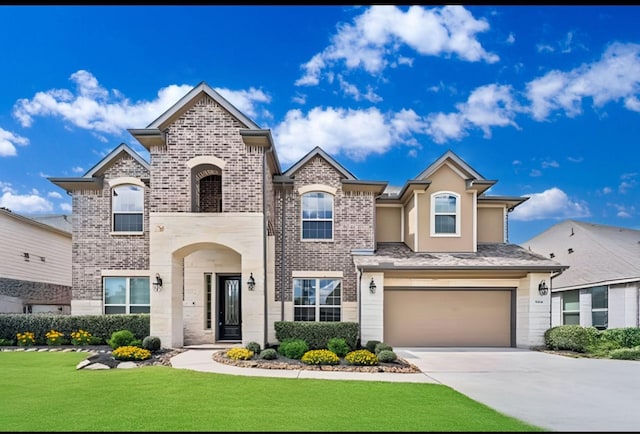 view of front of house with a garage and a front lawn