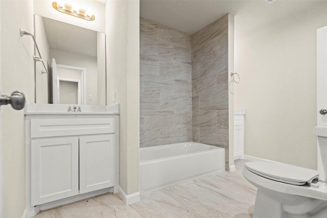 full bathroom featuring tiled shower / bath combo, toilet, and vanity