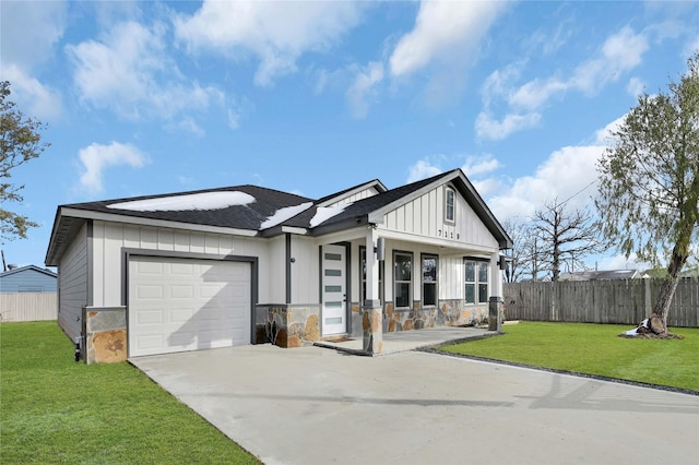 view of front of property with a garage and a front yard