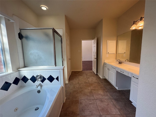 bathroom with vanity, independent shower and bath, and tile patterned flooring