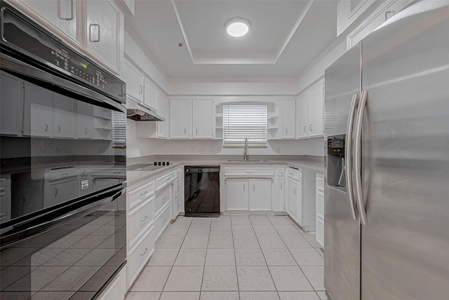 kitchen with light tile patterned flooring, sink, white cabinetry, a raised ceiling, and black appliances