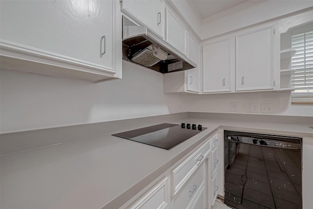 kitchen with white cabinetry and black appliances