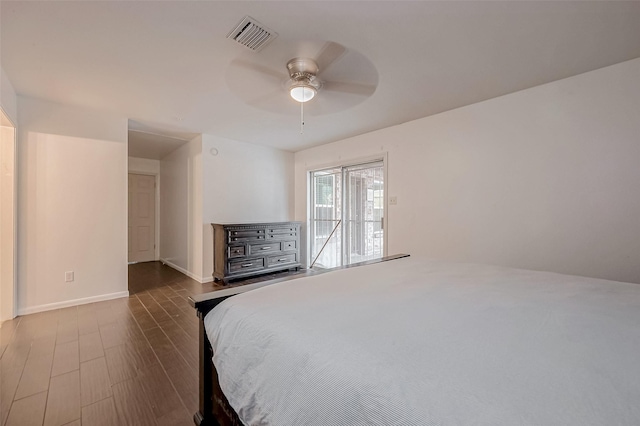 bedroom featuring dark hardwood / wood-style floors and ceiling fan