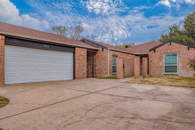 ranch-style house featuring a garage