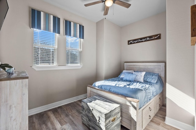 bedroom with wood-type flooring and ceiling fan