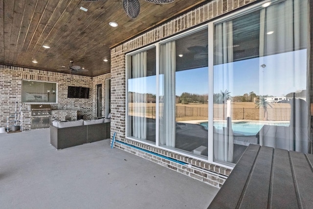 view of patio / terrace featuring ceiling fan and a fenced in pool