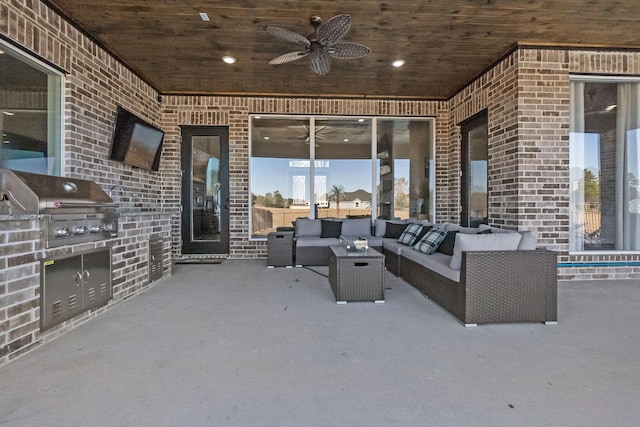 view of patio / terrace with exterior kitchen, outdoor lounge area, grilling area, and ceiling fan