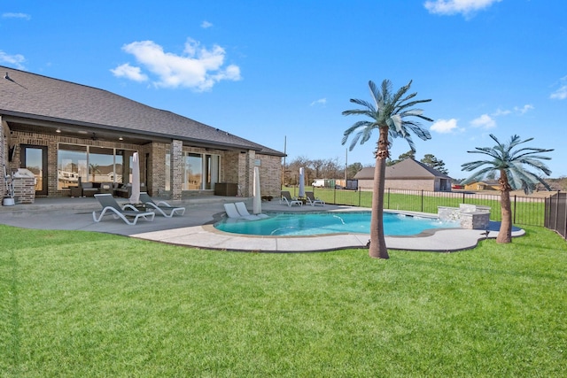 view of swimming pool with a patio and a lawn