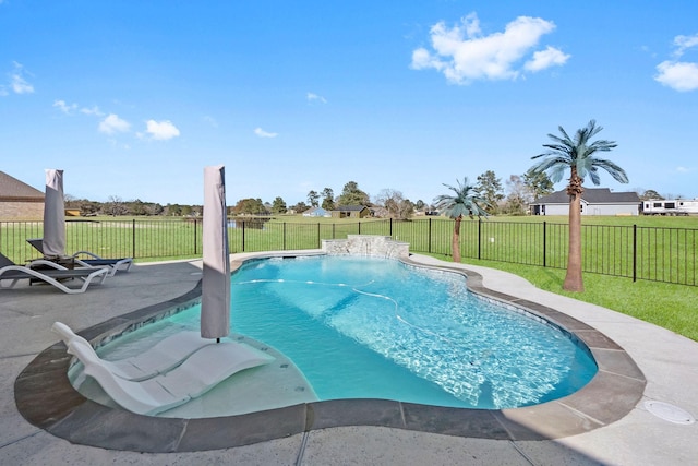 view of pool with a lawn and a patio