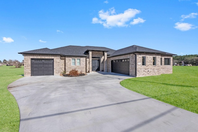 prairie-style house with a front yard and a garage