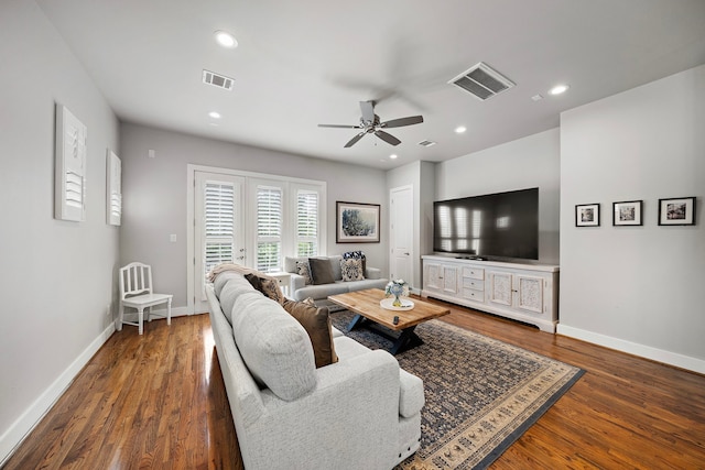 living room featuring visible vents, dark wood-style flooring, and recessed lighting