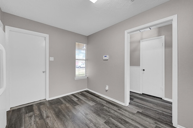 3807 Aspen Dr, La Porte, TX 77571 - foyer with dark wood-style flooring and baseboards