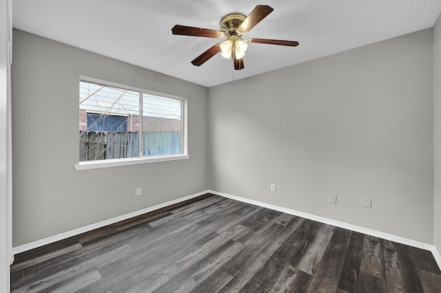 spare room featuring ceiling fan, a textured ceiling, and dark hardwood / wood-style flooring