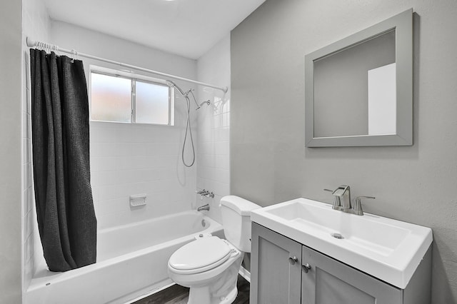 full bathroom featuring vanity, shower / tub combo, and toilet