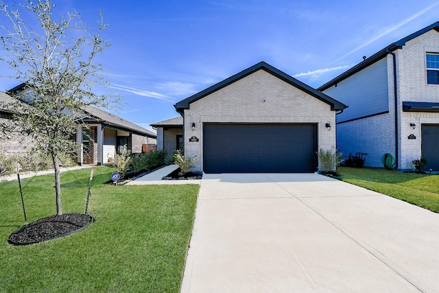 view of front of home featuring a garage and a front lawn