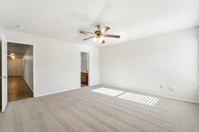 unfurnished room featuring ceiling fan and carpet flooring