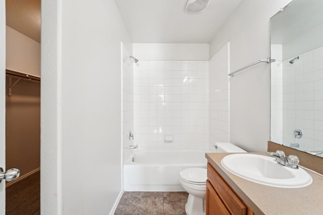 full bathroom featuring toilet, vanity, and tiled shower / bath