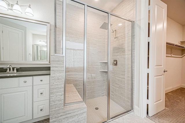 bathroom with an enclosed shower and vanity