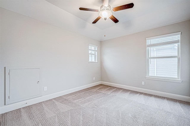 spare room featuring carpet flooring and ceiling fan