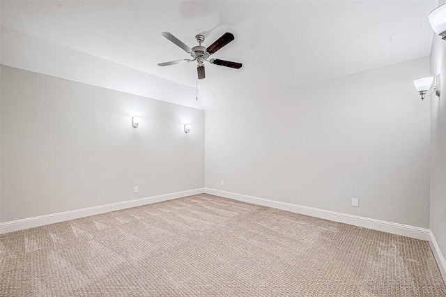 carpeted empty room featuring ceiling fan