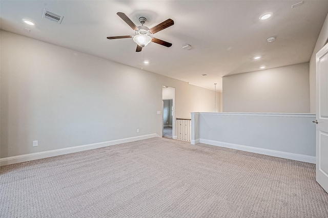 interior space with light carpet and ceiling fan