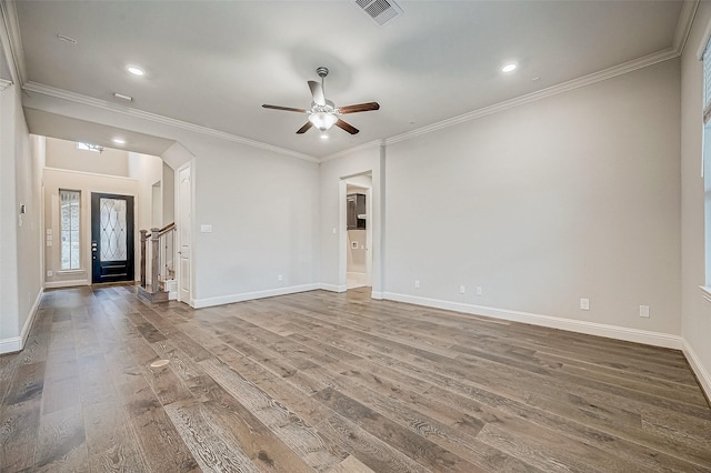 unfurnished living room featuring ceiling fan, crown molding, and hardwood / wood-style floors