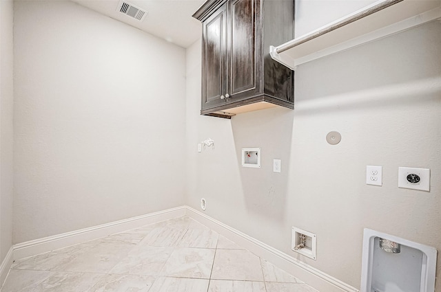 washroom with hookup for an electric dryer, cabinets, washer hookup, and hookup for a gas dryer