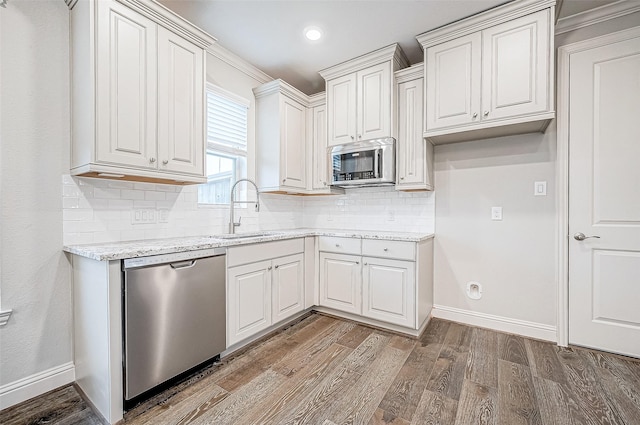 kitchen featuring sink, white cabinetry, and appliances with stainless steel finishes