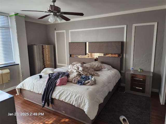 bedroom with ceiling fan and dark hardwood / wood-style flooring