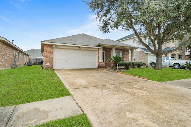 view of front of home with a garage and a front lawn