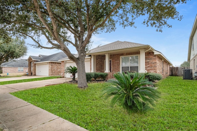 single story home with a garage, central AC unit, and a front yard