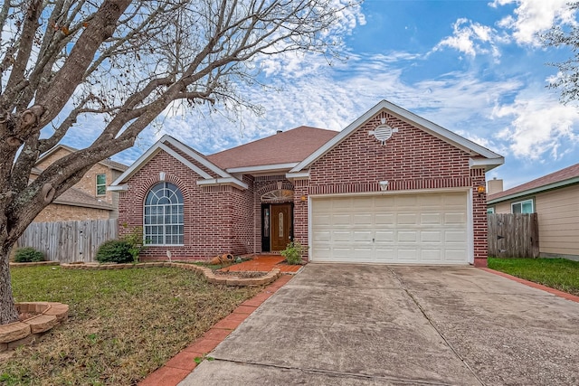 view of front of house with a garage and a front lawn