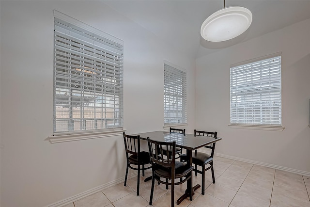 dining space with light tile patterned flooring