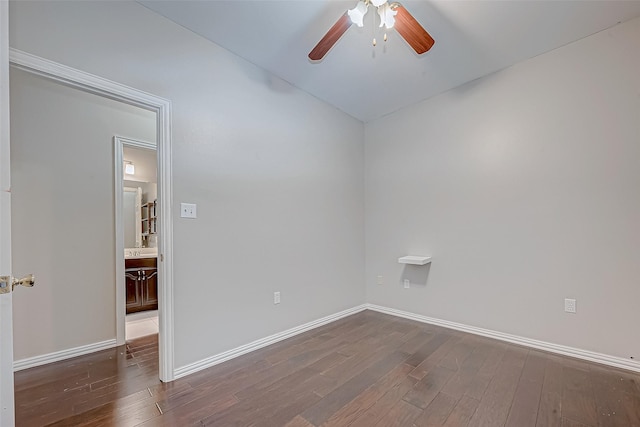 empty room featuring dark hardwood / wood-style floors and ceiling fan