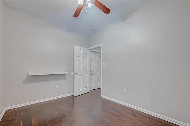 spare room with ceiling fan and dark hardwood / wood-style flooring