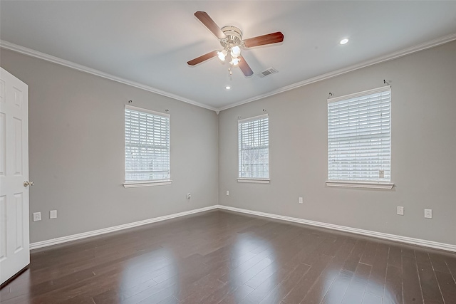 spare room featuring ceiling fan, ornamental molding, and dark wood-type flooring