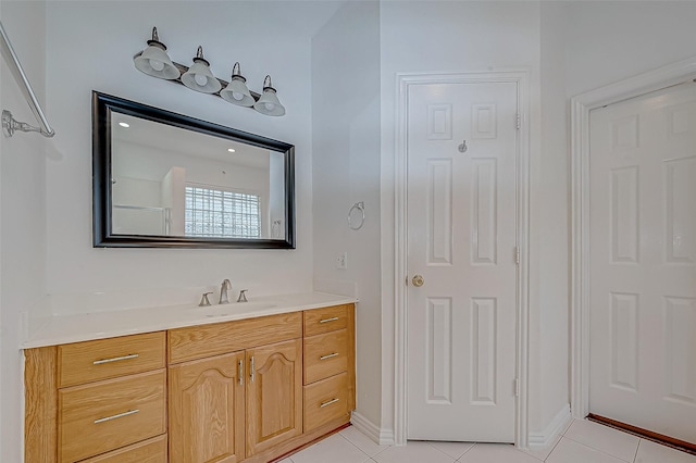 bathroom with tile patterned floors and vanity