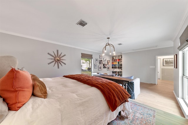 bedroom featuring light hardwood / wood-style floors and ornamental molding