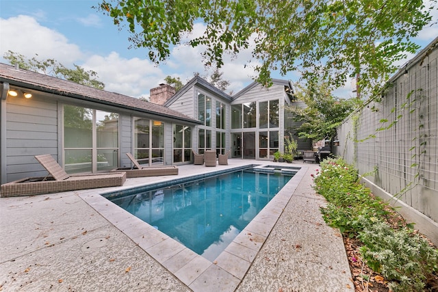 view of swimming pool featuring a patio area